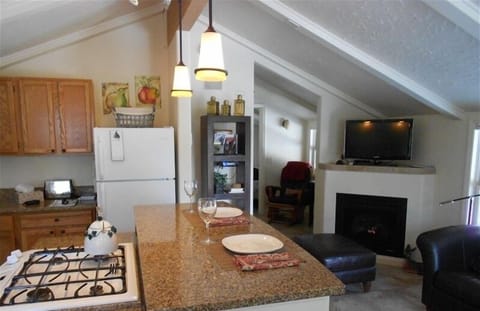 Breakfast bar, gas fireplace and flat screen TV.