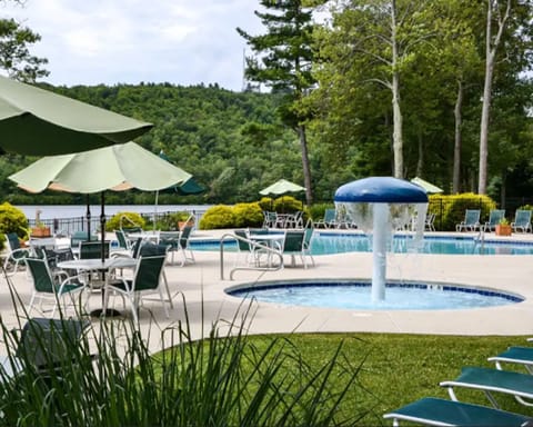 Seasonal outdoor pool, open 10:00 AM to 6:00 PM, pool umbrellas