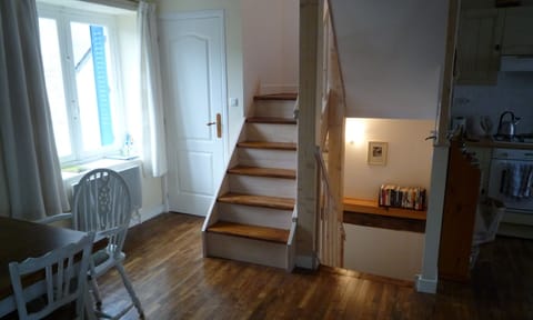 Stairs up and down and main floor powder room