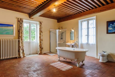 Carmen's bathroom with freestanding cast iron bath, shower and bidet.