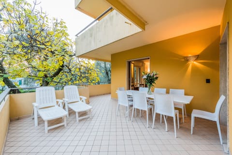 Main terrace with partial lake view through the olive garden and mountain view