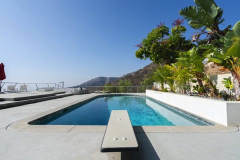 Solar heated pool is 10 feet deep at deep end.