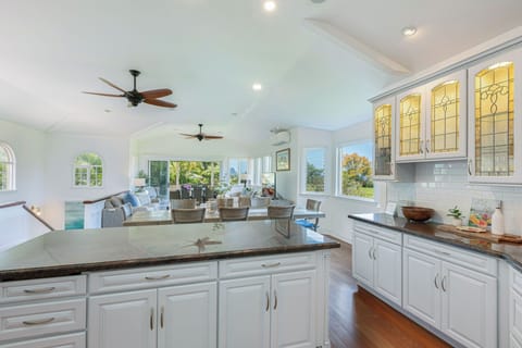 Open kitchen layout with sleek counters and island seating, ideal for preparing group meals and entertaining.