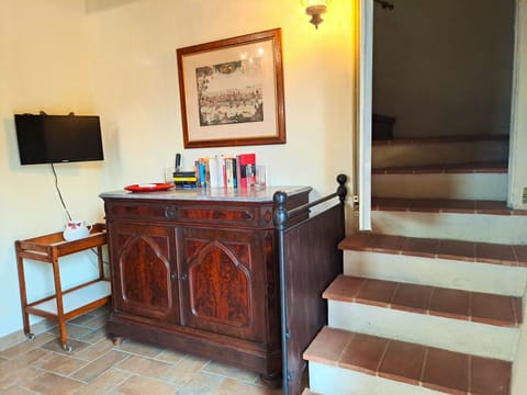 he living room on the ground floor, with stairs to the upper floor