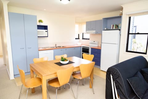 Apartment 1 | Private kitchen | Full-size fridge, microwave, stovetop, electric kettle