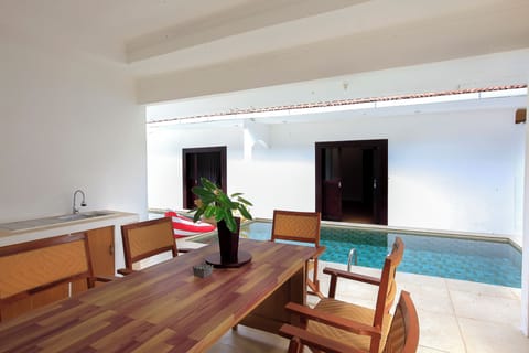 Family Double Room, 3 Bedrooms, Pool View | In-room dining