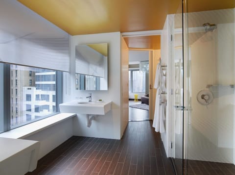 Deluxe Suite, 1 King Bed, City View | Bathroom | Shower, rainfall showerhead, designer toiletries, hair dryer