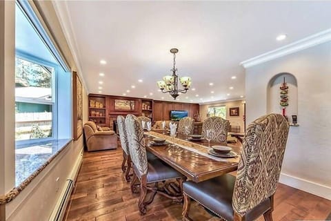 Great Room A Large customer designed Dinning table for 12. Addition chair inside Garage