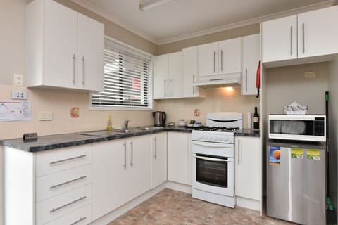 Cottage, 1 Queen Bed | Private kitchen | Fridge, microwave, coffee/tea maker, electric kettle