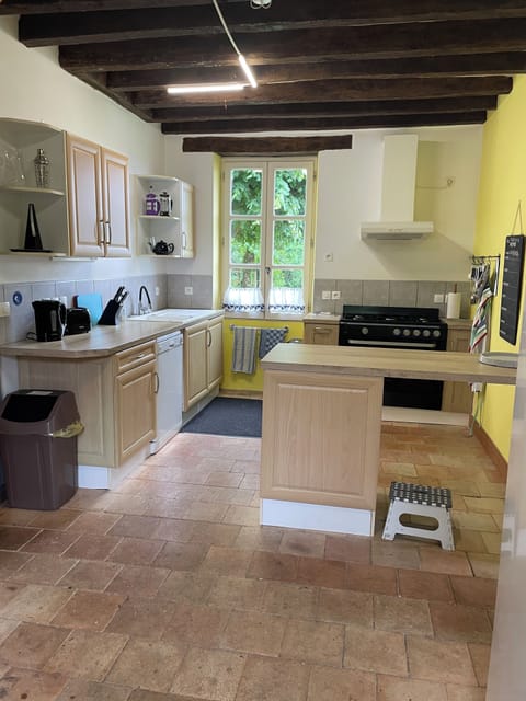 Kitchen with dishwasher, washing machine, two fridges one with small frezer