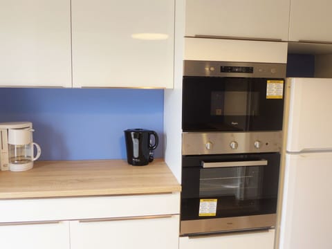 Property, Room, Cabinetry, Furniture, Kitchen, Microwave Oven, Countertop, Small Appliance, Home Appliance, Kitchen Appliance