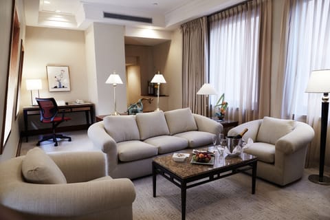 Suite, 1 King Bed (Townhouse) | Living area | 50-inch LED TV with cable channels