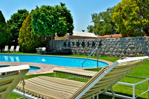 Outdoor pool, open 9 AM to 8 PM, pool umbrellas, sun loungers