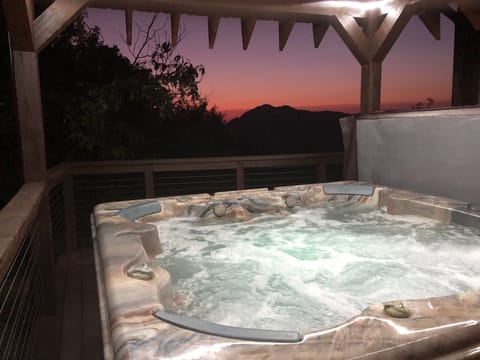 Hot tub on the back porch with sunset view!