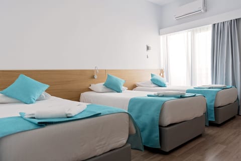 Standard Triple Room | Pillowtop beds, in-room safe, iron/ironing board, free cribs/infant beds