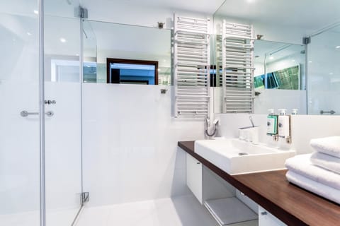 Design Apartment | Bathroom | Shower, designer toiletries, hair dryer, bathrobes