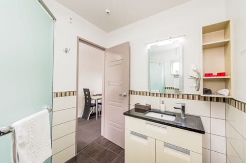 Studio | Bathroom | Shower, designer toiletries, hair dryer, towels