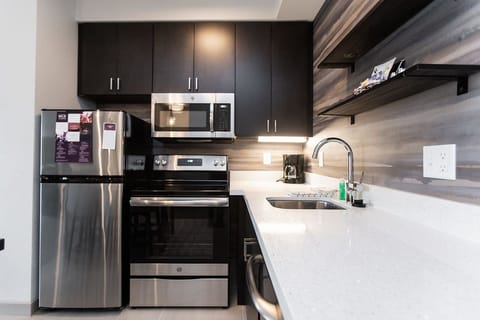 Suite, 1 Bedroom | Private kitchen | Full-size fridge, microwave, oven, stovetop