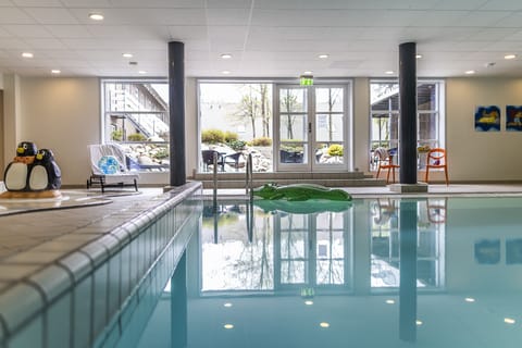 Indoor pool, open 7:00 AM to 10:00 PM, sun loungers