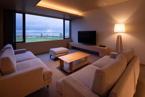 Japanese Western Style Suite, Sea View | Living room | Flat-screen TV