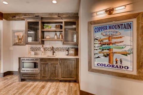 Enjoy the lower rec area with a wet bar, mini fridge, and plenty of seating—perfect for relaxing or entertaining after a day of mountain activities