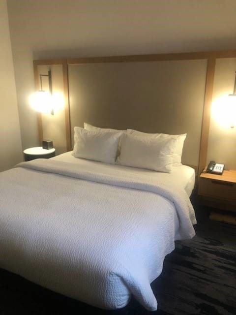 Desk, laptop workspace, blackout drapes, iron/ironing board