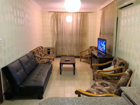 Apartment, 2 Bedrooms, Sea View | Living room | Flat-screen TV