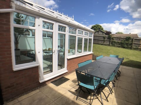 View of patio and back garden
