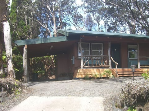 Front of cottage, with carport and covered back entrance to house.