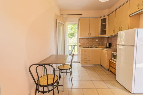 Family Apartment, Balcony, Partial Sea View | Private kitchen | Full-size fridge, oven, stovetop, coffee/tea maker