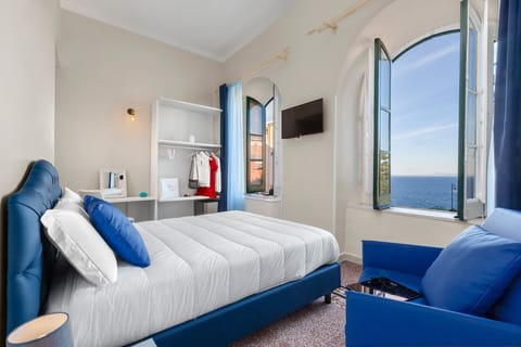 Deluxe Triple Room, Sea View | Individually decorated, individually furnished, free WiFi, bed sheets