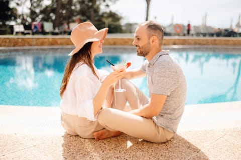 Outdoor pool, pool umbrellas, sun loungers