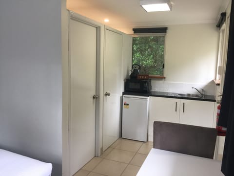 Small 15sq, Queen Room | Private kitchenette | Fridge, microwave, coffee/tea maker, electric kettle