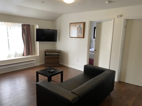 Standard Suite, 2 Bedrooms, Garden View | Living area | Flat-screen TV