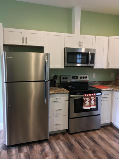 Full-sized refrigerator and microwave.