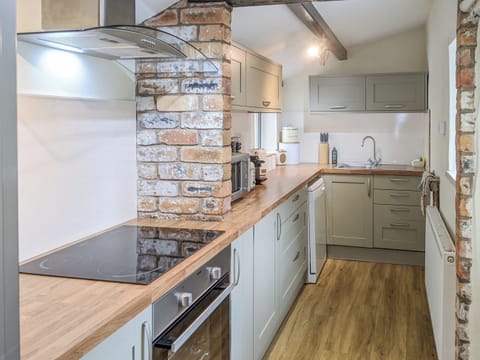 Well appointed galley style kitchen | Seascape Cottage, Allonby, near Maryport