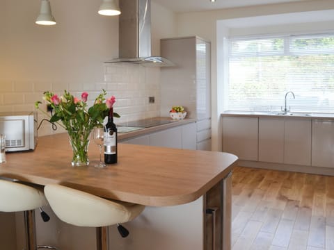 Attractive well appointed kitchcen with breakfast bar | Estuary View, Exmouth