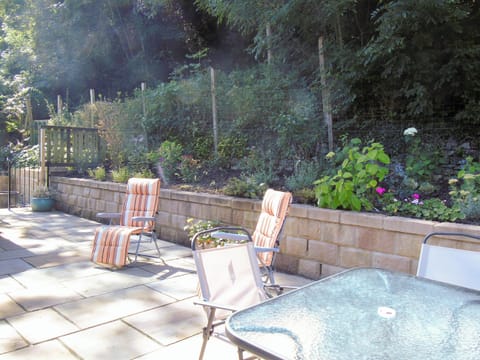 Enclosed patio with garden furniture and BBQ | Netherwood, Bakewell