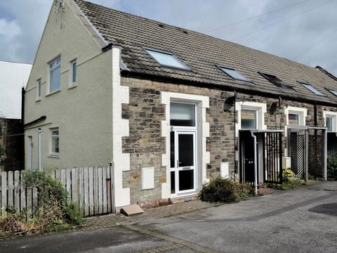 One of a terrace of lovely Cumbrian cottages converted from a chapel | Ghillie Cottage, Cockermouth