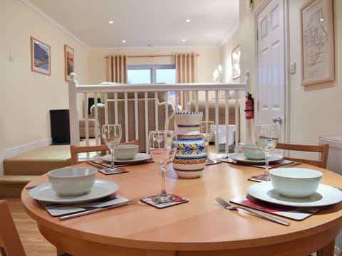 Charming dining area and galleried living area | Woodside Cottage, Ecclerigg, near Ambleside