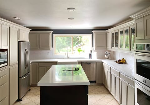 2020 remodelled kitchen with granite countertop and glass cook top.