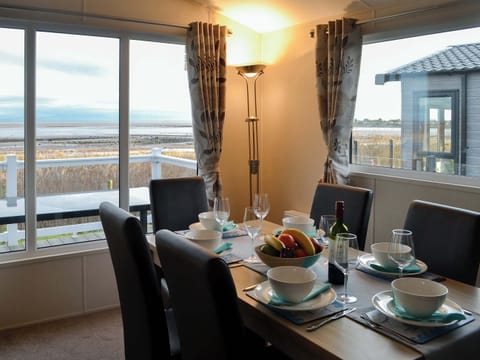 Dining area with dual aspect views | Beachcomber Lodge, Southerness, near Dalbeattie