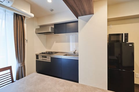 Family Condo, Non Smoking | Private kitchen | Full-size fridge, microwave, stovetop, rice cooker