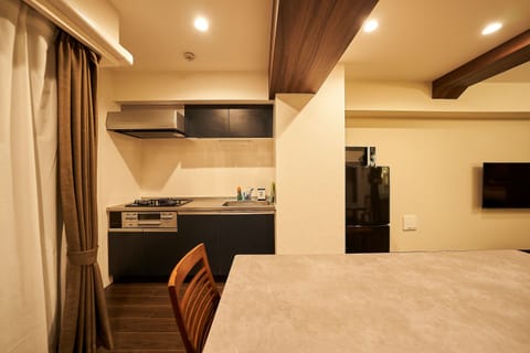 Family Condo, Non Smoking | Private kitchen | Full-size fridge, microwave, stovetop, rice cooker