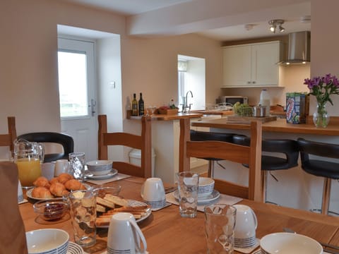Kitchen with dining area | Rhosydd Cottage, Llandyfrydog, near Amlwch