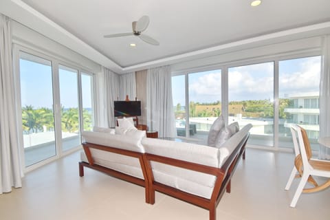 Premier One Bedroom Suite Sea View | Living area | 43-inch flat-screen TV with cable channels, TV