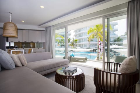 Premier One Bedroom Suite Pool View | Living area | 43-inch flat-screen TV with cable channels, TV