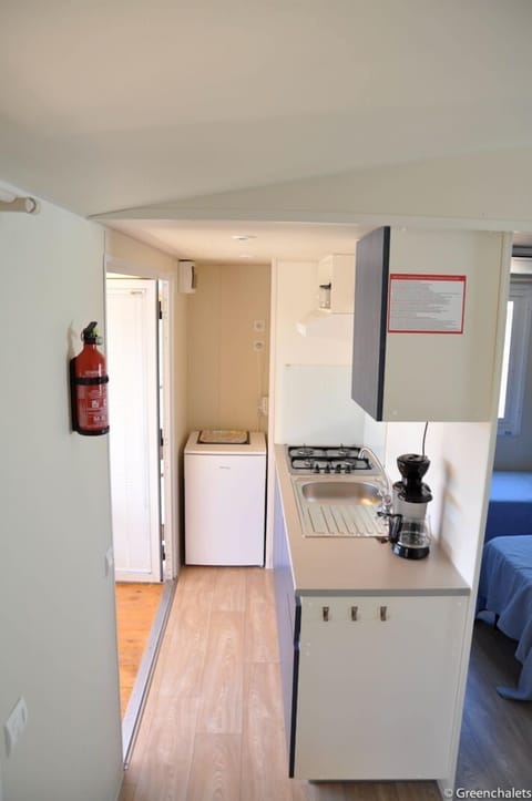 Comfort Mobile Home, 2 Bedrooms, Park View | Private kitchen | Coffee/tea maker, highchair, cookware/dishes/utensils