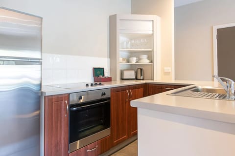 Premium Suite, 1 Bedroom | Private kitchen | Fridge, microwave, stovetop, dishwasher