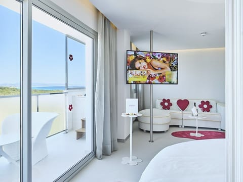 Suite, Hot Tub, Sea View (Sunset View Suite) | Living area | Flat-screen TV